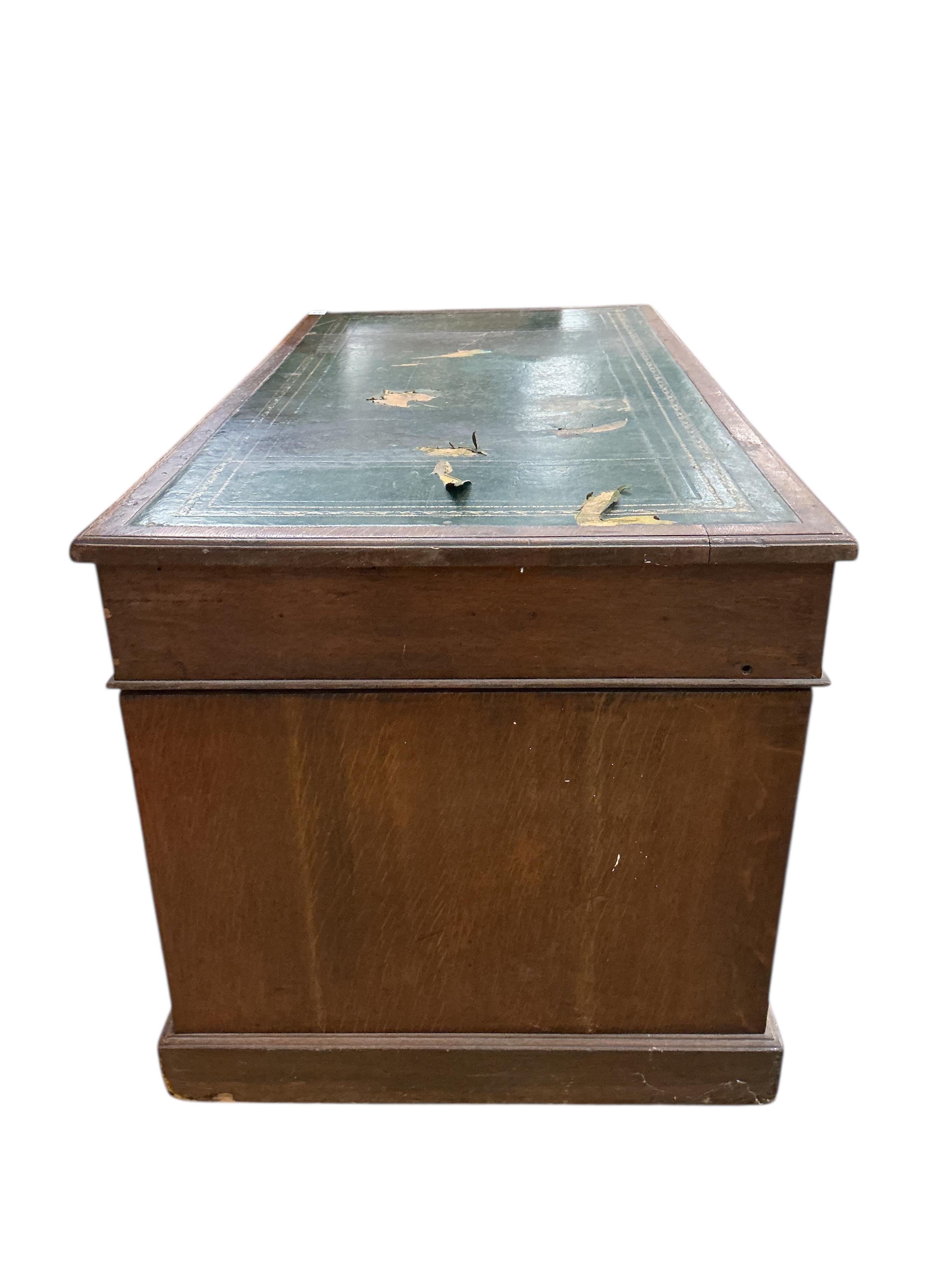 A Victorian oak pedestal desk, width 136cm, depth 72cm, height 75cm